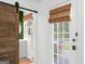 Hallway with pool access, sliding barn door, neutral palette, and great natural light at 396 Ebenezer Rd, Fayetteville, GA 30215