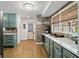 Modern kitchen showcasing exposed brick, custom cabinets, and counter tops at 396 Ebenezer Rd, Fayetteville, GA 30215