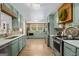 Well-designed kitchen with stainless steel appliances, quartz countertops, and shaker-style cabinetry at 396 Ebenezer Rd, Fayetteville, GA 30215