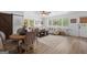 Inviting living room with wood floors, comfortable seating, and plenty of natural light from large windows at 396 Ebenezer Rd, Fayetteville, GA 30215