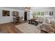 Spacious living room featuring wood floors, comfortable seating, and large windows for natural light at 396 Ebenezer Rd, Fayetteville, GA 30215