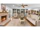 Inviting living room with a cozy fireplace, built-in bookshelves, and comfortable seating at 396 Ebenezer Rd, Fayetteville, GA 30215