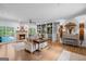 Bright and airy living room featuring fireplace and a view to the outdoor pool at 396 Ebenezer Rd, Fayetteville, GA 30215