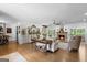 Open-concept living room with fireplace, hard wood flooring and lots of natural light at 396 Ebenezer Rd, Fayetteville, GA 30215