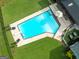 Aerial view of the pool with an inflatable toy, chairs, and green grass at 396 Ebenezer Rd, Fayetteville, GA 30215