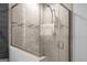 Modern shower with tiled walls, glass door and brushed nickel fixtures at 396 Ebenezer Rd, Fayetteville, GA 30215