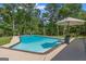 Private backyard with swimming pool and patio area for relaxation and outdoor enjoyment at 396 Ebenezer Rd, Fayetteville, GA 30215