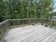 Wooden back deck overlooking a wooded backyard at 248 Webster Lake Dr, Temple, GA 30179