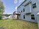 A spacious backyard with a deck and a view of a two-story house at 248 Webster Lake Dr, Temple, GA 30179