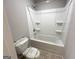 Bathroom with tub/shower combo and toilet at 248 Webster Lake Dr, Temple, GA 30179