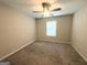 Bright bedroom features a ceiling fan and window at 248 Webster Lake Dr, Temple, GA 30179