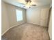 Bedroom featuring neutral walls, carpet, and a window with blinds and natural light at 248 Webster Lake Dr, Temple, GA 30179