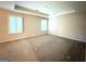 Spacious bedroom with a tray ceiling, carpet, and natural light from two large windows at 248 Webster Lake Dr, Temple, GA 30179