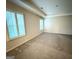 Bedroom featuring neutral walls, a tray ceiling, carpet, and lots of natural light at 248 Webster Lake Dr, Temple, GA 30179