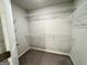Walk-in closet featuring white wire shelving and neutral walls with carpeted floor at 248 Webster Lake Dr, Temple, GA 30179