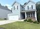 Traditional two-story home featuring a two-car garage and meticulously maintained landscaping, enhancing its curb appeal at 248 Webster Lake Dr, Temple, GA 30179
