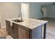 Large kitchen island featuring a sink, dishwasher, granite countertop, and space for dining or food preparation at 248 Webster Lake Dr, Temple, GA 30179