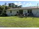 Spacious backyard with a seating area and well-maintained green grass at 4790 Hwy 101 N, Rockmart, GA 30153