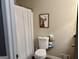 Bathroom featuring a toilet and a shower with white tile at 4790 Hwy 101 N, Rockmart, GA 30153