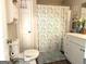 Full bathroom featuring a toilet and a shower with a decorative curtain and a cabinet at 4790 Hwy 101 N, Rockmart, GA 30153