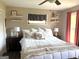 Comfortable bedroom featuring a ceiling fan and shelves with space for decoration at 4790 Hwy 101 N, Rockmart, GA 30153