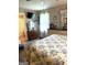 Bright bedroom with ensuite bath, wood floors, and decorative vanity with mirror at 4790 Hwy 101 N, Rockmart, GA 30153