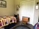 Cozy bedroom with Americana decor featuring a blue braided rug and a single-size bed at 4790 Hwy 101 N, Rockmart, GA 30153