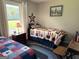 Comfortable guest bedroom featuring American flag decor, a blue braided rug, and a single-size bed at 4790 Hwy 101 N, Rockmart, GA 30153