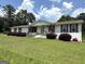 Charming single-story home featuring a well-manicured lawn and classic brick exterior at 4790 Hwy 101 N, Rockmart, GA 30153