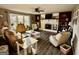 Cozy living room showcasing a brick fireplace, wood floors, and bright natural light at 4790 Hwy 101 N, Rockmart, GA 30153