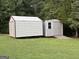 Two metal storage sheds on a lawn, providing extra storage space with a ramp for easy access at 4790 Hwy 101 N, Rockmart, GA 30153