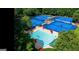 Aerial view of community pool and tennis courts, surrounded by lush trees at 710 Larkspur, Acworth, GA 30102