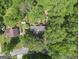 An aerial view of a home nestled among mature trees, offering privacy and a natural setting at 4352 Treeline Way, Douglasville, GA 30135