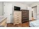Bedroom features two dressers on hardwood floors and neutral walls at 4352 Treeline Way, Douglasville, GA 30135