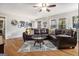 Bright living room with hardwood floors, large windows, and a comfortable sectional sofa at 4352 Treeline Way, Douglasville, GA 30135