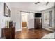 Main bedroom with hardwood floors, neutral walls, and an ensuite bathroom at 4352 Treeline Way, Douglasville, GA 30135