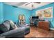 Bright home office with hardwood floors and a comfortable couch at 4352 Treeline Way, Douglasville, GA 30135