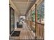 Inviting covered porch with outdoor seating, perfect for relaxing and enjoying the scenery at 4352 Treeline Way, Douglasville, GA 30135
