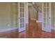 Open living area featuring hardwood floors and view of stairs at 834 Chalet Hills, Mcdonough, GA 30253