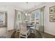 Cozy dining area with modern chandelier, views of backyard, and stylish decor at 10422 Trellis Lane (Lot 38), Hampton, GA 30228