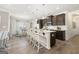 Modern kitchen with island seating, stainless steel appliances, and ample cabinet space at 10422 Trellis Lane (Lot 38), Hampton, GA 30228