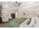A main bedroom displays a tray ceiling, plush carpet, and windows allowing lots of natural light at 10422 Trellis Lane (Lot 38), Hampton, GA 30228