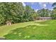A large, well-maintained backyard offers ample space for recreation, complemented by a storage shed at 351 Weldon Rd, Palmetto, GA 30268
