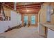 Spacious unfinished basement area with pegboard wall, exposed ceiling, and natural light from two windows at 351 Weldon Rd, Palmetto, GA 30268