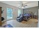 Nicely decorated bedroom with a ceiling fan, luxury chair and two bright, sunlit windows at 351 Weldon Rd, Palmetto, GA 30268