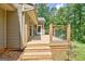 Wooden deck with stairs and a metal railing, perfect for outdoor relaxation at 351 Weldon Rd, Palmetto, GA 30268