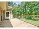 Enjoy outdoor living on this wood deck with metal railing and a view of the tree-lined backyard at 351 Weldon Rd, Palmetto, GA 30268