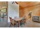 This dining room offers a stone accent wall, wood paneled walls, and a rustic table at 351 Weldon Rd, Palmetto, GA 30268