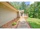 Charming home exterior with landscaped walkway and inviting wooden deck at 351 Weldon Rd, Palmetto, GA 30268