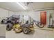 Spacious garage area with storage for tools, toys, and lawn equipment at 351 Weldon Rd, Palmetto, GA 30268